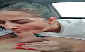Lusty mature lady sucking stiff cock in the car 